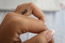 infinity memorial finger tattoo