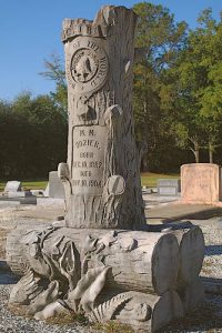 wood man of the world grave stones